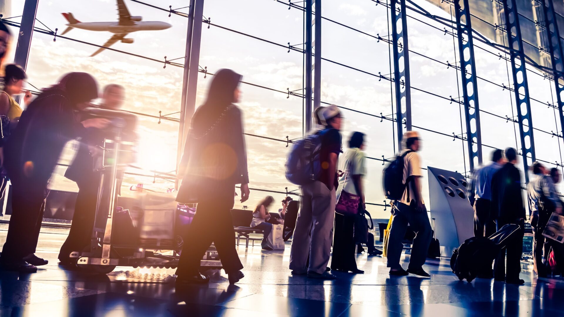 Busy airport with figures in motion and an airplane taking off