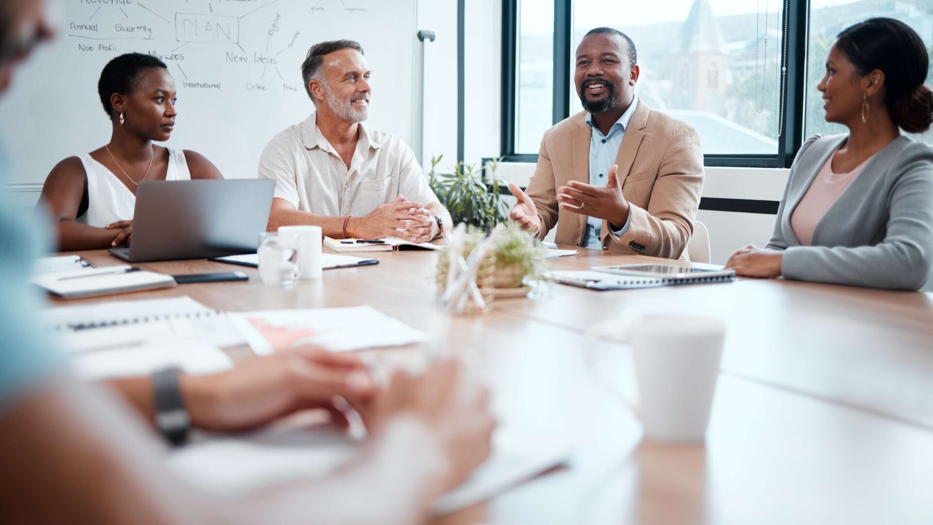 Happy business people, meeting and strategy in planning, team discussion or sharing idea at office. Group of employees in teamwork, collaboration or discussing project plan in conference at workplace.