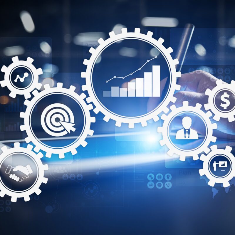 Illustration of gears with graphs, targets, and various icons in their centers