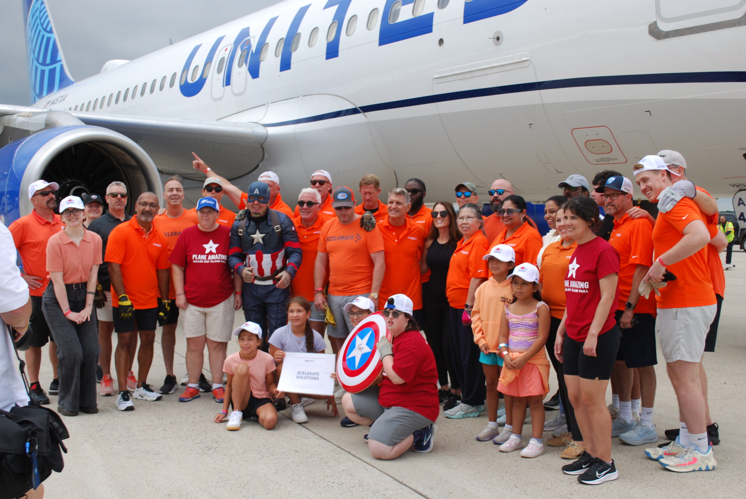 The HQ team, partners, family, friends and even Captain America pulled a United Airlines plane to raise money for Special Olympics. It was our first year and we placed 4th.